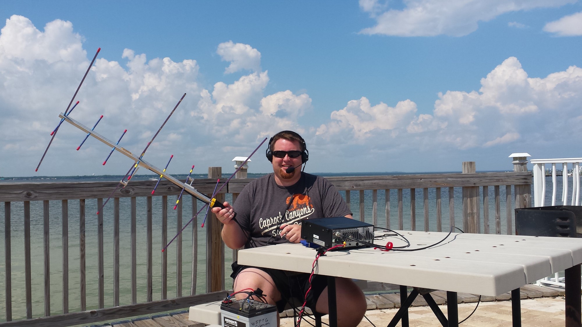 Clayton Coleman, W5PFG, shows off his portable satellite station.